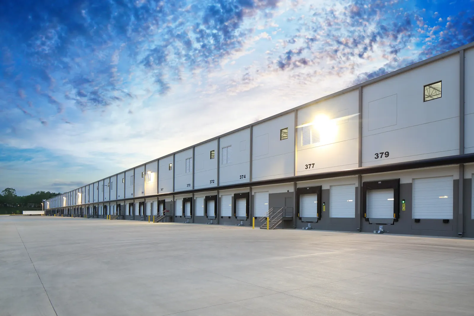 Warehouse exterior with loading docks and separate personnel entrances